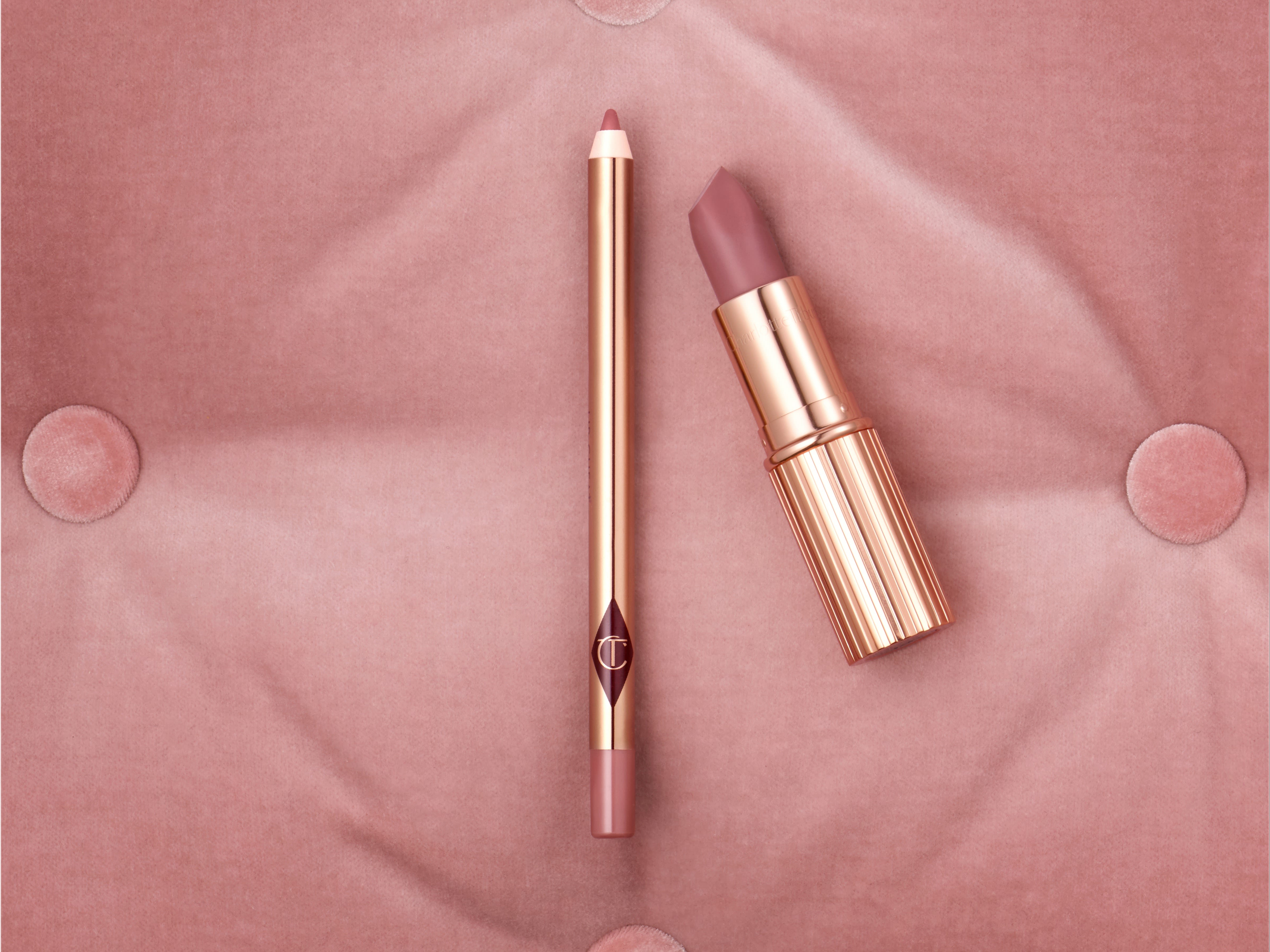 An open lip liner pencil in a nude pink shade and an open matte lipstick in a nude pink shade.