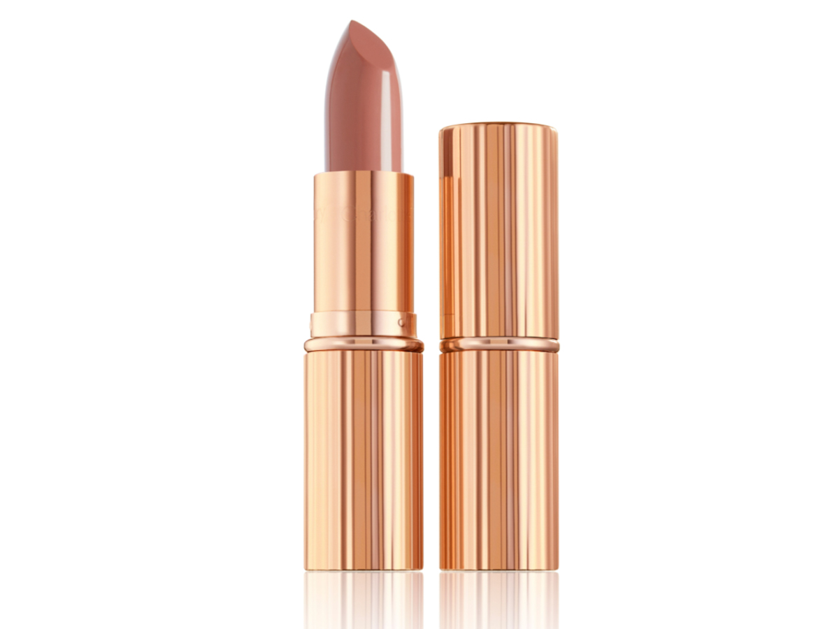 two lipsticks, with and without lid, in soft rosy peach shade with a satin finish in sleek gold-coloured packaging.