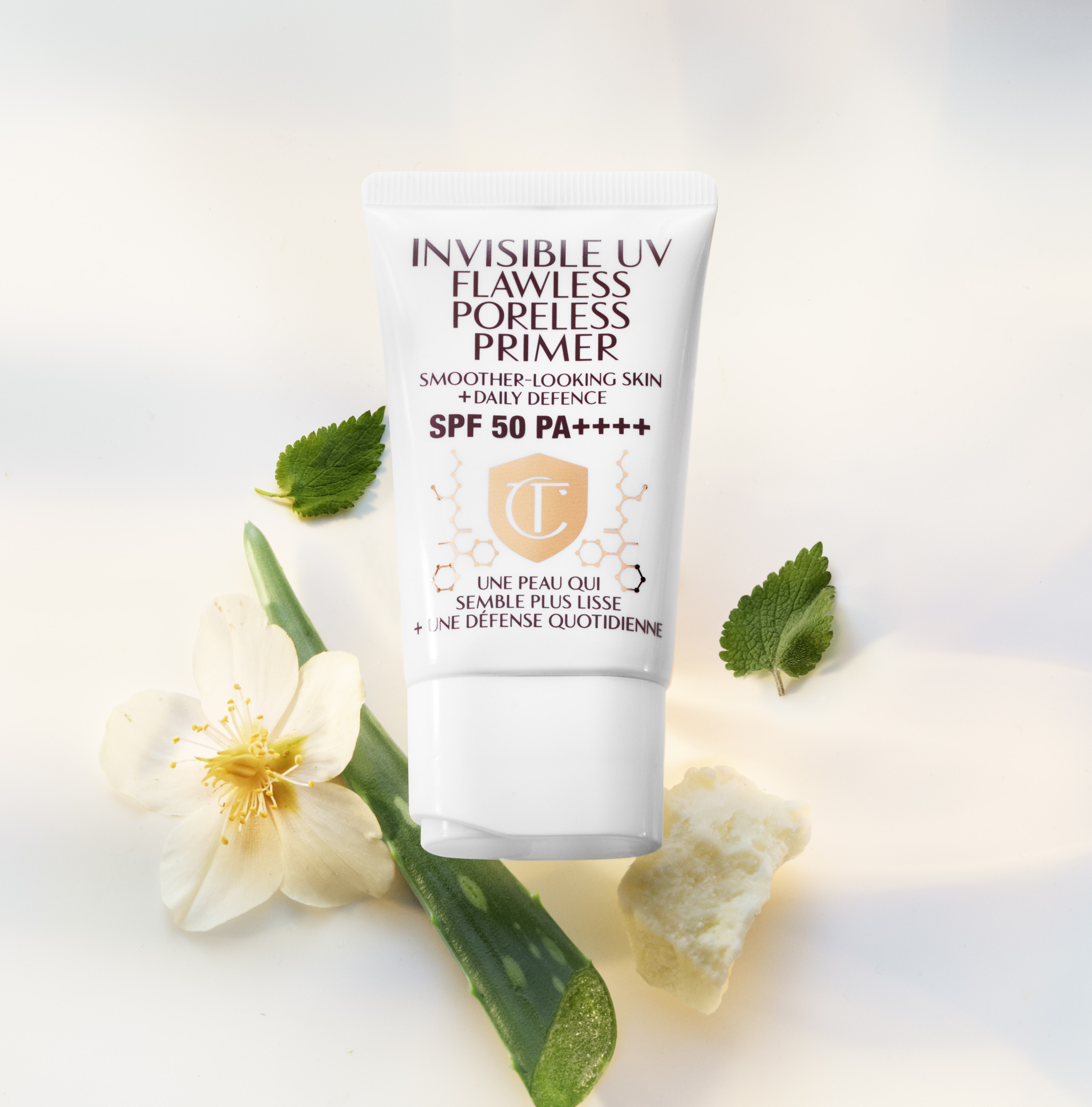 Banner with a primer in a white-coloured tube with a white-coloured lid with text on it that reads, 'invisible UV Flawless poreless primer SPF 50 PA++++'.
