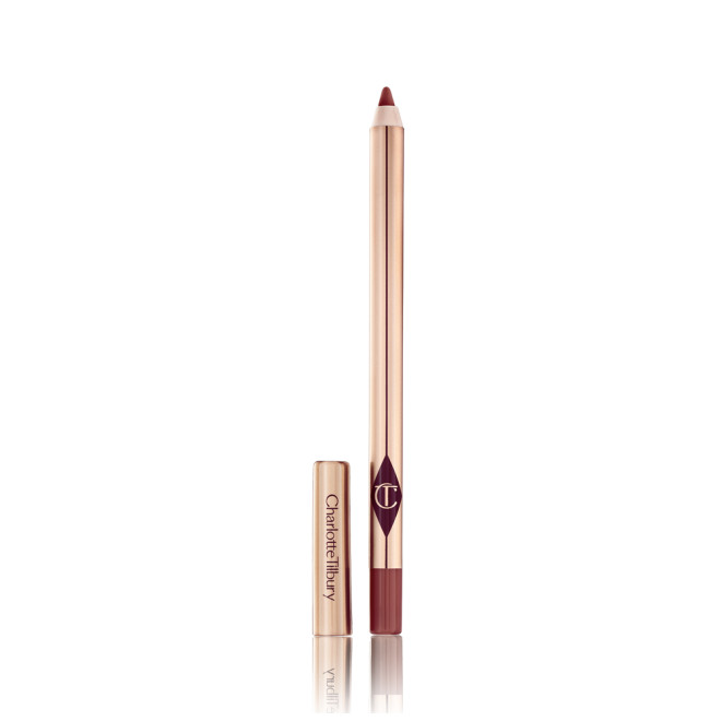 A lip liner in a berry-pink shade with its lid next to it. 