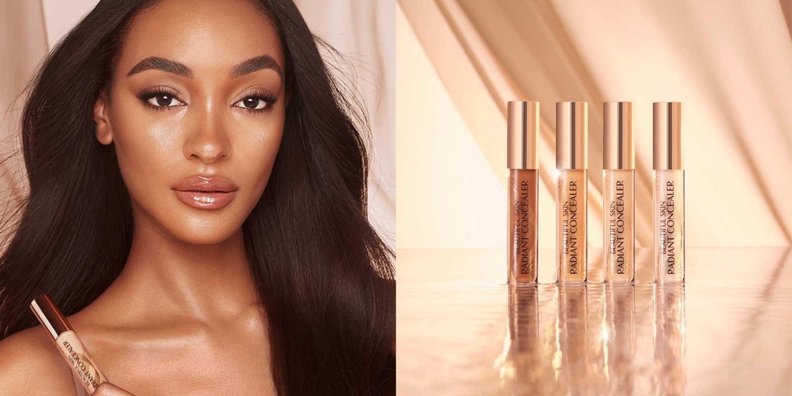 Banner with a deep-tone model with glowy skin, wearing nude full-glam makeup and a collection of creamy concealers with a radiant, glowy finish in glass tubes with gold-coloured lids for skin tones of all types.