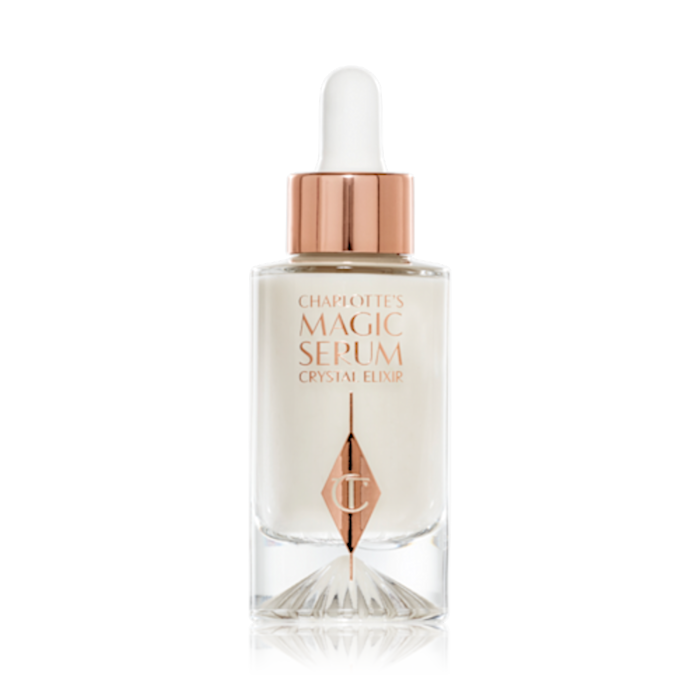 A luminous, ivory-coloured facial serum in a glass bottle with a white and gold-coloured dropper lid, 