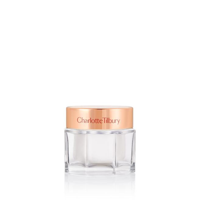 Charlotte's Magic Cream closed Pearly-white face cream in a glass jar with a gold-coloured lid.