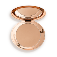 An open mirrored-lid bronzer compact in a light shade. 