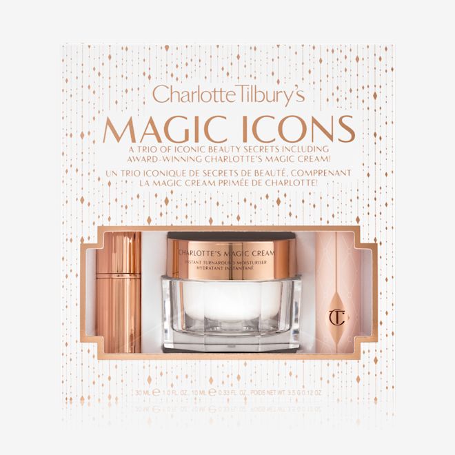 Charlotte Tilbury's Magic Icons kit packed Pearly-white face cream in a glass jar with a gold-coloured lid, black mascara in a pink tube with a gold-coloured lid, and matte lipstick in a gold-coloured tube packed inside a white-coloured gift box with the text, 'Charlotte Tilbury's Magic Icons' written on it in reflective, gold colour.