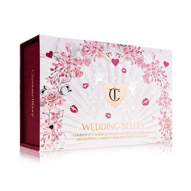 Bridal Bundle 1 Wedding Belles Box still life A makeup kit in a white-coloured gift box with hearts and lipstick kiss prints all over with the text, 'Wedding Belles' written on the front.