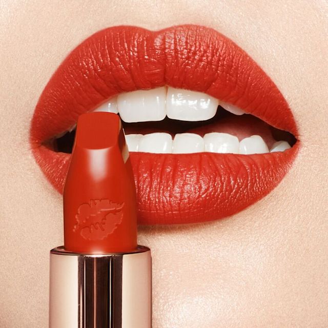 Brunette model wearing Red Hot Susan Hot Lips lipstick