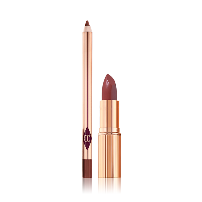 Luscious Lip Slick in walk of no shame open duo An open rose-pink lip liner pencil and open rose-pink lipstick, both in the iconic, golden, Charlotte Tilbury packaging.