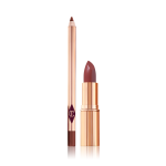 An open rose-pink lip liner pencil and open rose-pink lipstick, both in the iconic, golden, Charlotte Tilbury packaging. 