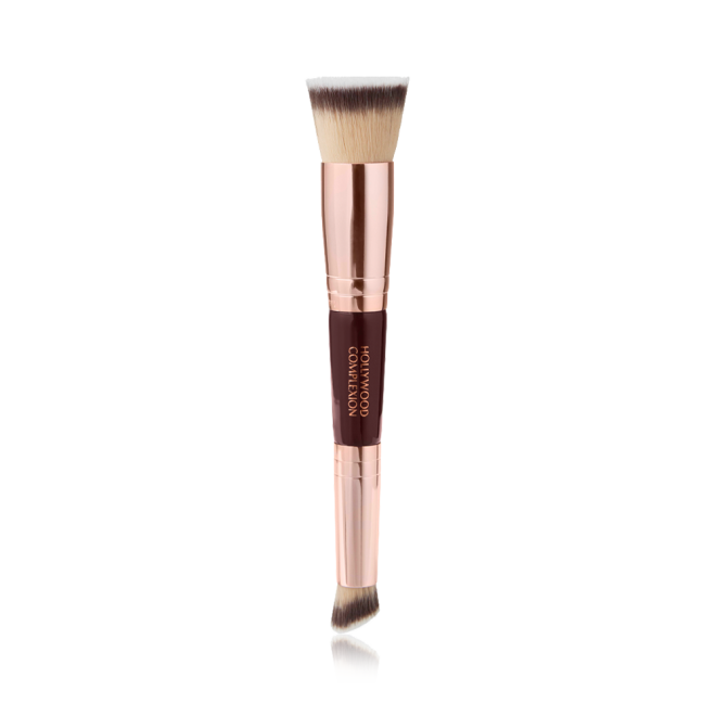 A double-ended contour brush with soft bristles and rose gold and dark crimson handle. 