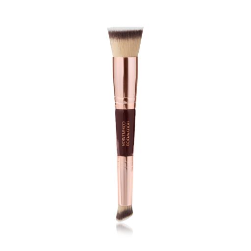 A double-ended contour brush with soft bristles and rose gold and dark crimson handle. 