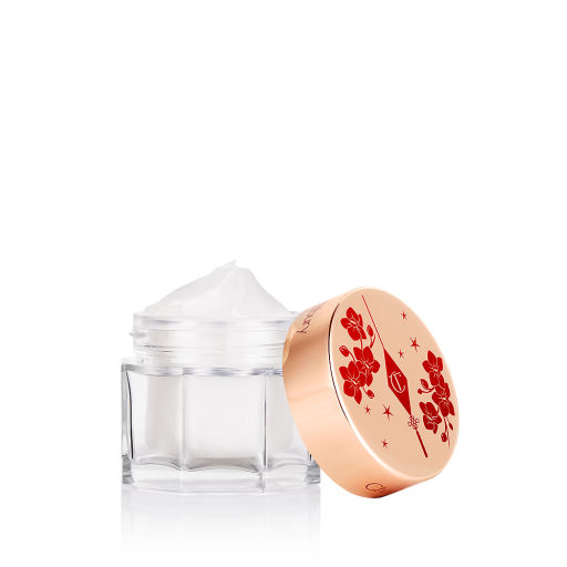 A jar of cream moisturiser in a gold and red blossom packaging