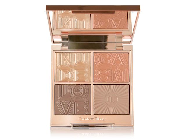 An open face palette with a mirrored lid with a reflective fawn eyeshadow that can be used as a highlighter, dark brown-peach blush, and a contour and eyeshadow duo in brown shades.