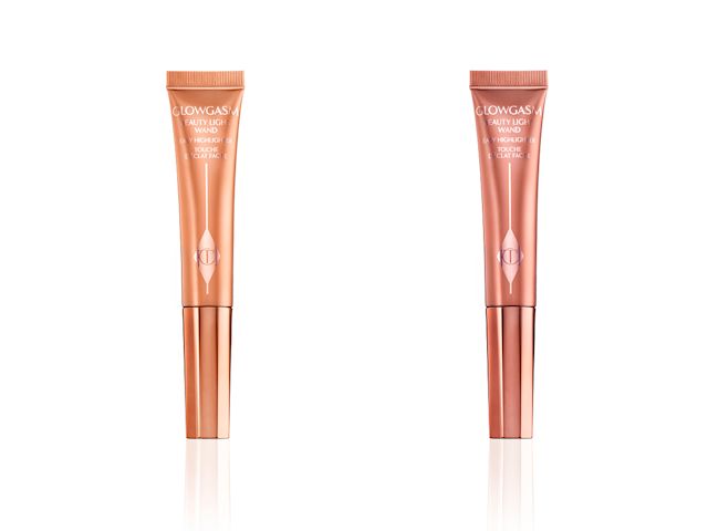 Two highlight blush wands in rose-pink and peachy-copper shades with reflective, elegant-looking packaging. 