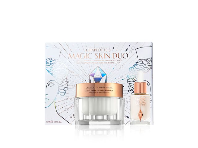 Pearly-white face cream in a glass jar with gold-coloured lid and a luminous face serum in a glass bottle with a white and gold-coloured dropper lid, with a white-coloured box behind them. 