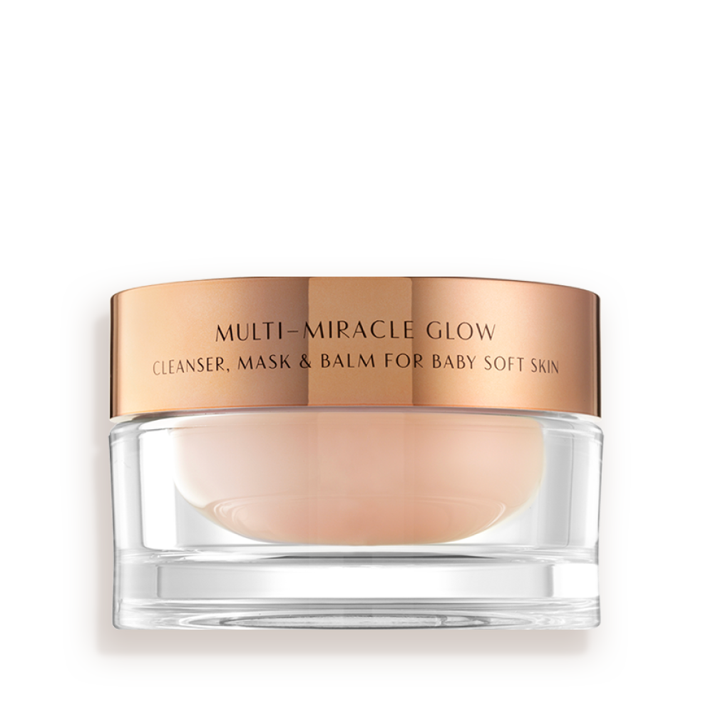 A 3-in-1 face fawn-coloured cleanser, mask, and balm in a glass jar with gold-coloured lid.