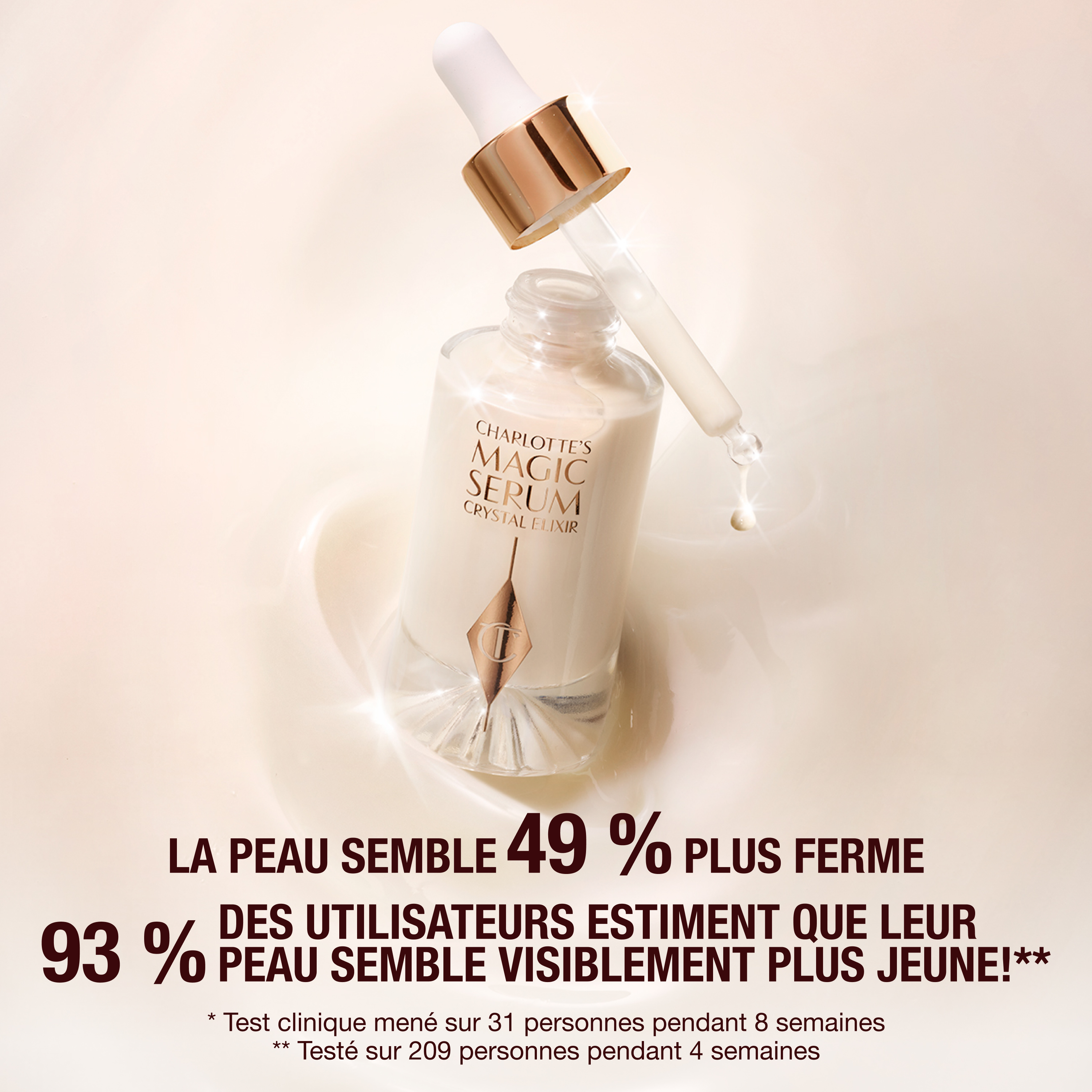 Crystal Magic Serum in a clear, glass bottle with a glass dropper in rose-gold packaging. 