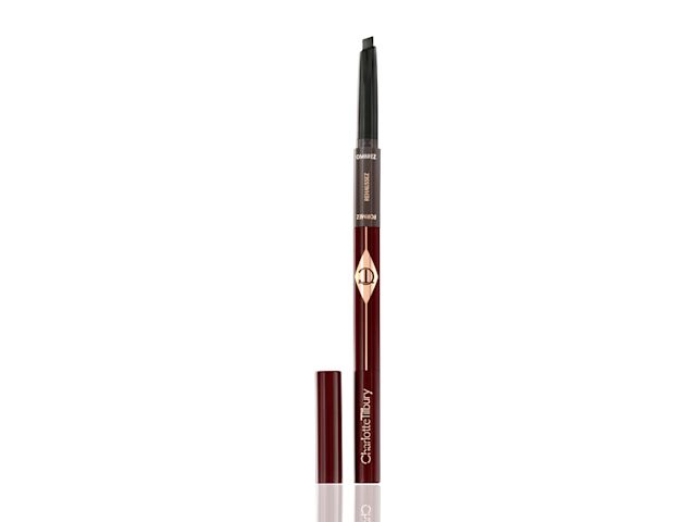 An open eyebrow pencil to fill, add shape and structure to eyebrows in dark crimson and gold-coloured packaging. 