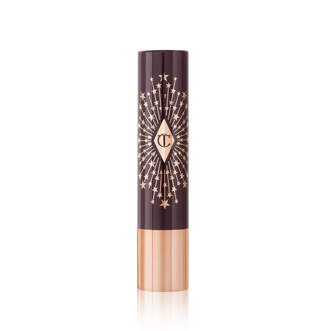 Lipstick lip balm in black and gold packaging.