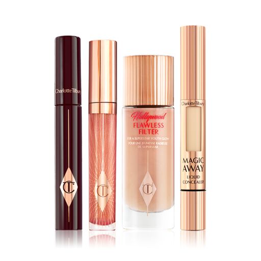 A mascara with a nude-pink lip gloss, a glow-boosting illuminating primer in a glass bottle, and a concealer with a small window on the tube that shows the colour of the concealer inside. 