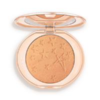 An open highlighter powder compact in a true gold shade with a mirrored lid.