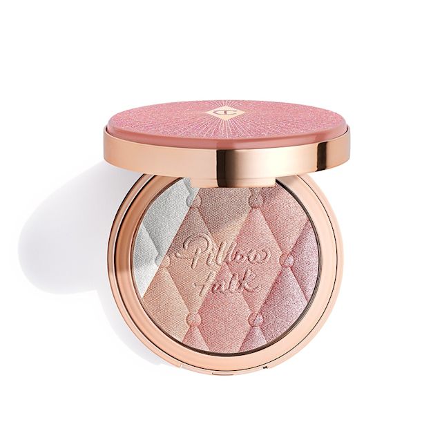 An open, pressed powder highlighter compact, with a mirrored-lid, in various shades of pink and gold for cool-tone complexions. 