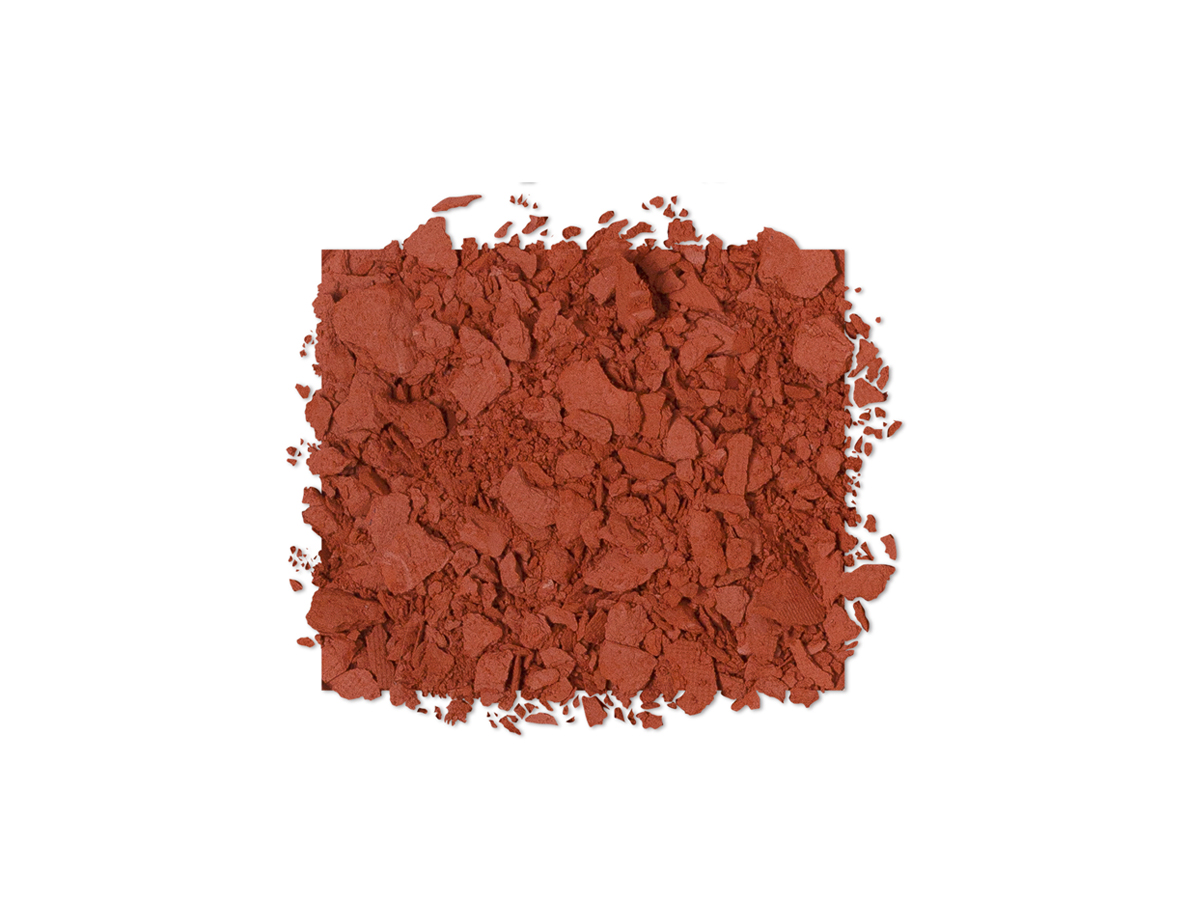 Swatch of russet-brown-coloured powder eye shadow.