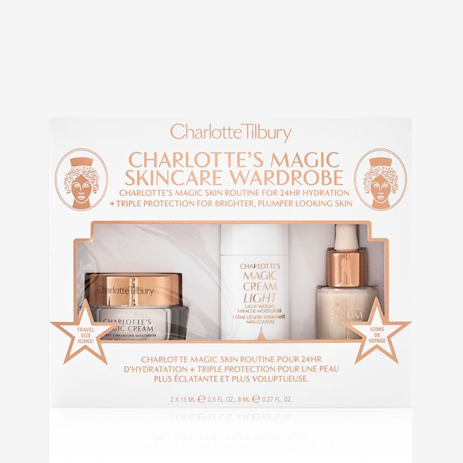 Magic Skincare Wardrobe packed A packed skincare kit containing a travel-size pearly-white cream in a glass jar with a gold-coloured lid, luminous serum in a glass bottle with a white and gold dropper lid, and face cream in a white-coloured bottle.