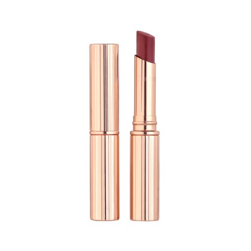 Two lipstick lip blams, with and without lid, in a berry-pink shade with gold-coloured packaging.