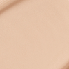 Close-up swatch of a skin-like, glowy foundation in a soft beige shade.