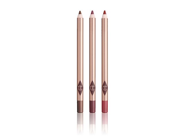 An open, lip liner trio in taupe-brown, nude pink, and berry pink shades. 
