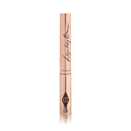 A closed tube of eyebrow gel in gold-coloured packaging.
