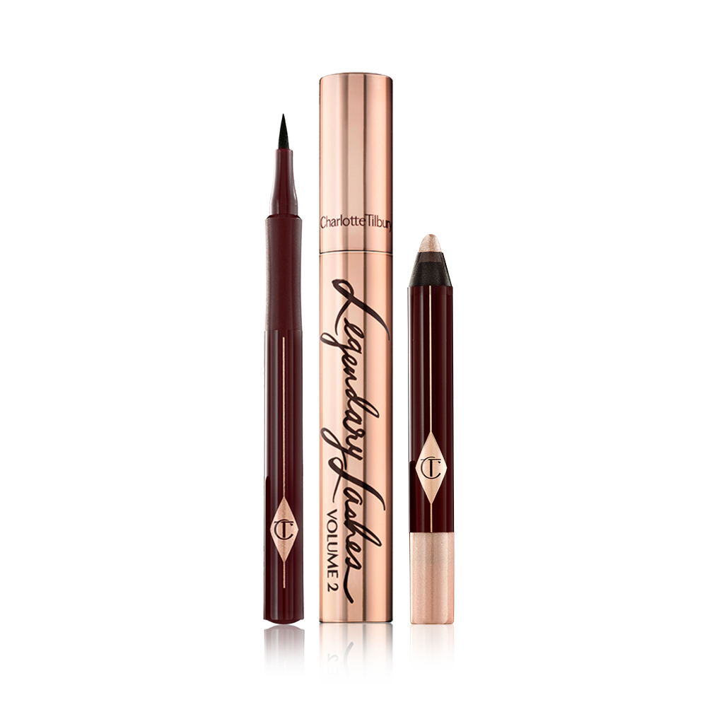 Black eyeliner pen with thin tip for precise application, black mascara in a gold-coloured tube, chubby eyeshadow stick in a champagne shade. 