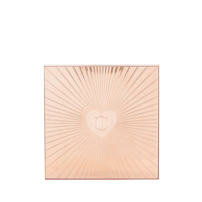 A closed, face palette with a rose-gold-coloured lid with a starburst pattern on top along with the CT logo embossed in the middle.