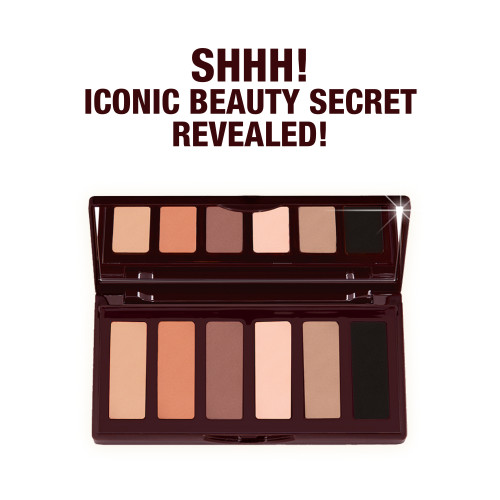 An open, mirrored-lid, 6-pan eyeshadow palette in shimmery and matte nude shades. 