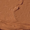 Swatch of a hydrating cream bronzer in a medium-brown shade.