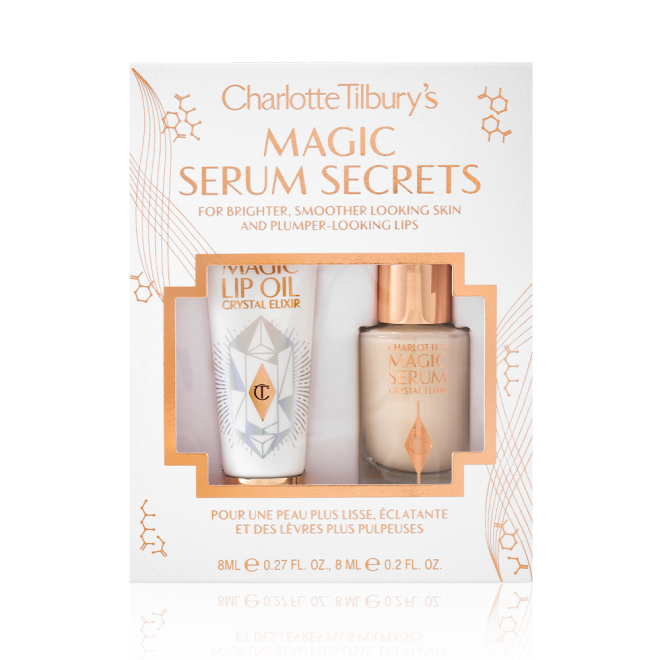 Travel-size lip oil in a white-coloured tube with a gold-coloured lid and a mini, glow-enhancing serum in a glass bottle with a gold and white-coloured dropper lid packed in their gift sleeve in white colour with the text, 'Magic serum secrets' written on it'.