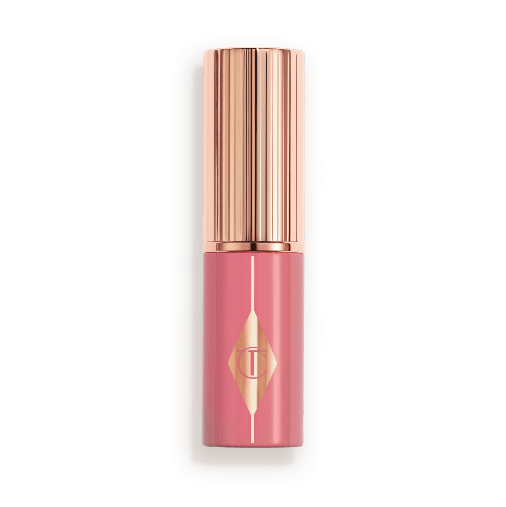 Muted pink packaging with a rose gold lid and detailing. 