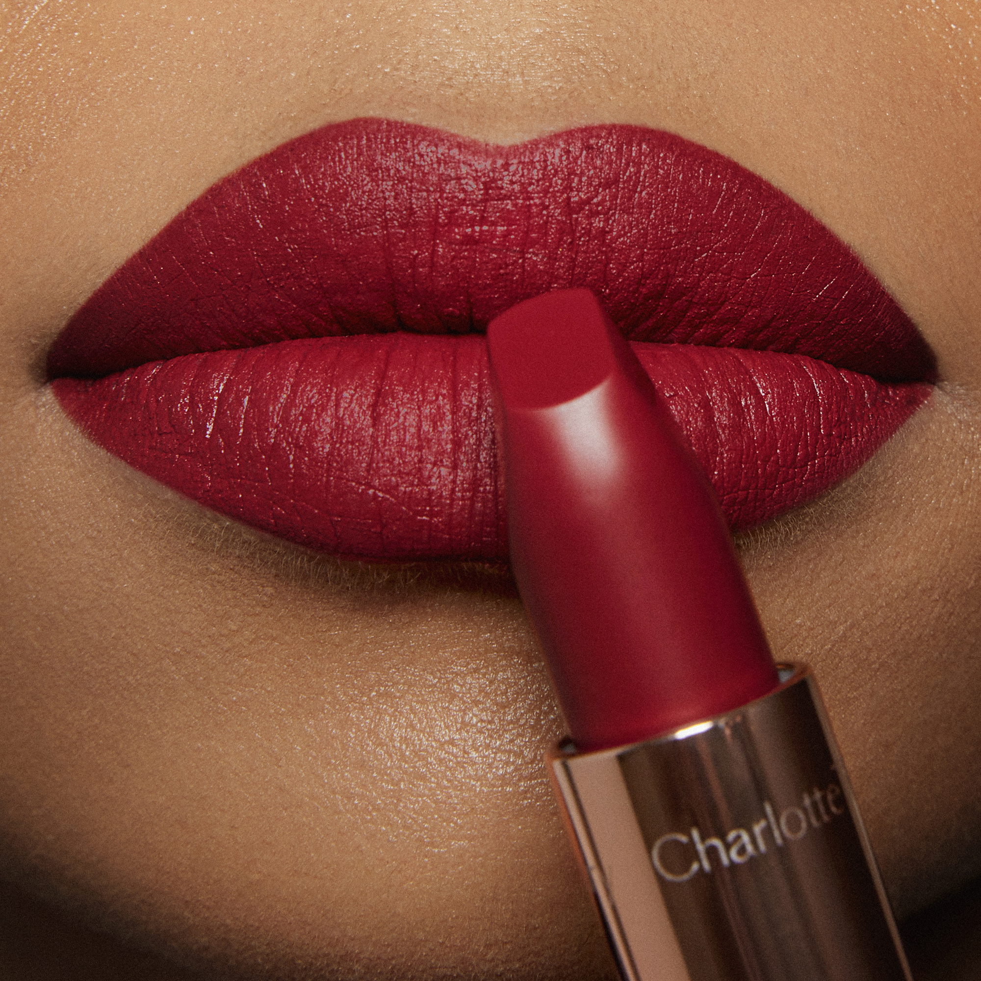 Model wearing Red Carpet Red ruby-red Matte Revolution lipstick
