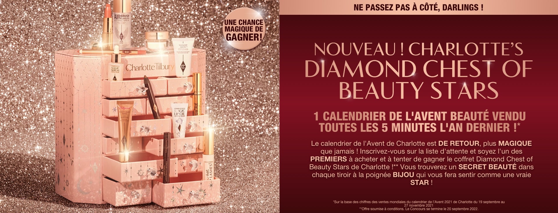 A pink-coloured chest of drawers with a clay mask, nude pink matte lipstick, nude pink lip liner, eyeliner pencil in dark copper, black-coloured mascara, liquid primer, champagne-coloured liquid highlighter, dark brown eyeliner pencil, pearly-white face cream, luminous ivory-coloured serum, and bronze-coloured body highlighter., and text that reads, 'A magical chance to win!'