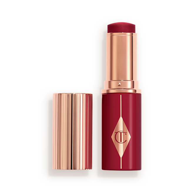 Unreal Blush Berry Glow Open Berry packaging matching to the stick product with a rose gold lid and detailing.