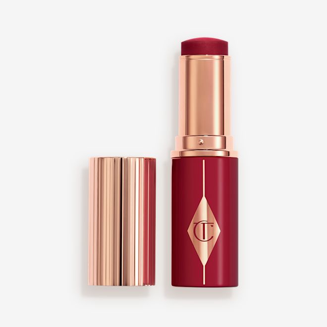 Unreal Blush Berry Glow Open Berry packaging matching to the stick product with a rose gold lid and detailing.