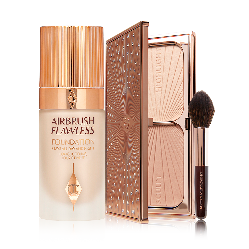 Foundation in a frosted glass bottle with a gold-coloured lid, duo contour palette, and a contouring brush with soft, black-brown-coloured bristles and a brown and gold-coloured handle.