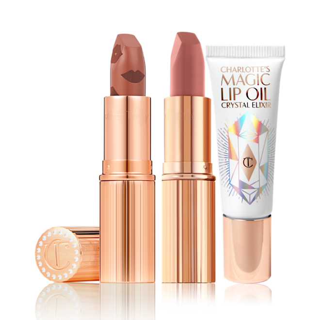 An open nude terracotta lipstick in golden-coloured packaging, open nude pink matte lipstick in golden-coloured packaging, and lip oil in a white-coloured tube with a reflective, geometrical pattern on the front.