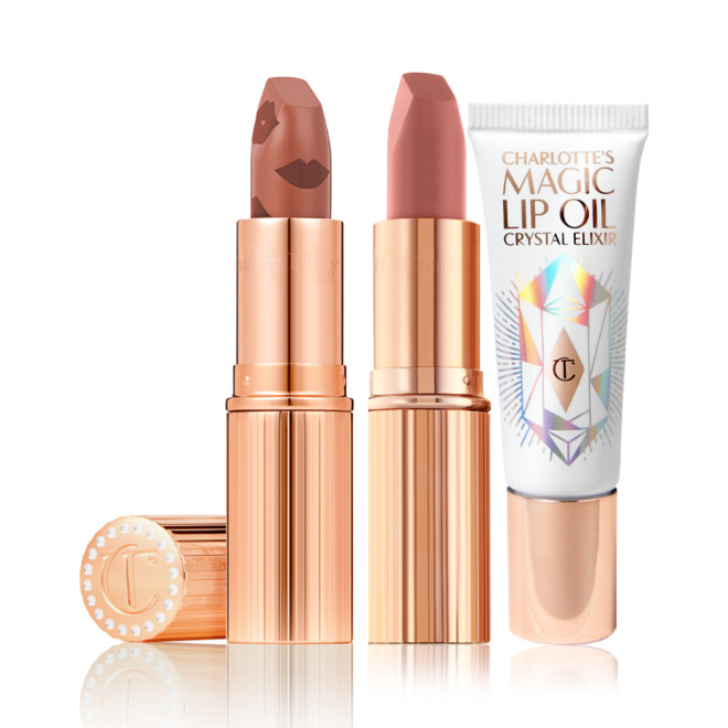 An open nude terracotta lipstick in golden-coloured packaging, open nude pink matte lipstick in golden-coloured packaging, and lip oil in a white-coloured tube with a reflective, geometrical pattern on the front.