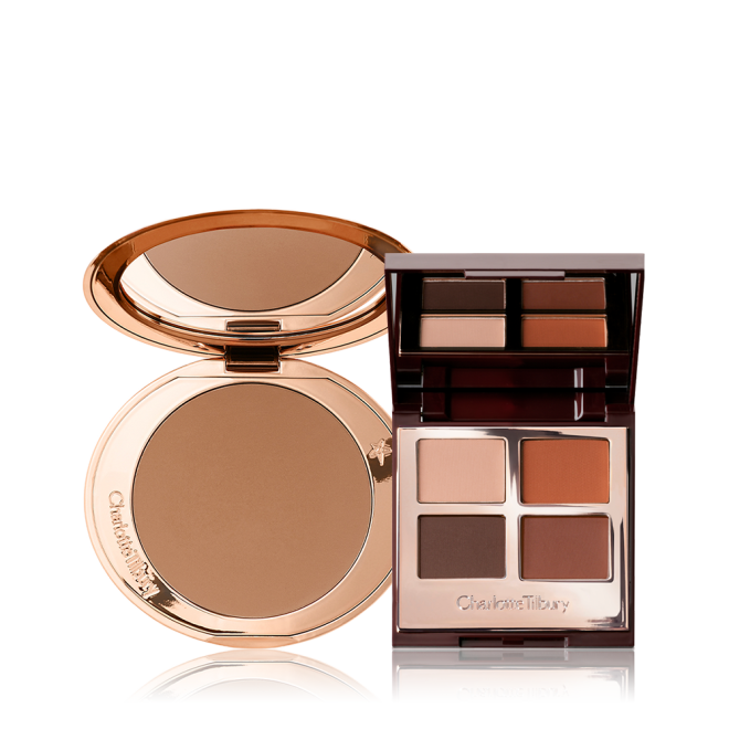 An open bronzer in medium-brown shade in golden-coloured compacts with an open, mirrored lid eye shadow palette with four matte and shimmery eye shadows in shades of brown and champagne.