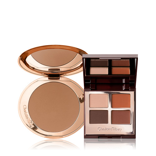An open bronzer in medium-brown shade in golden-coloured compacts with an open, mirrored lid eye shadow palette with four matte and shimmery eye shadows in shades of brown and champagne.
