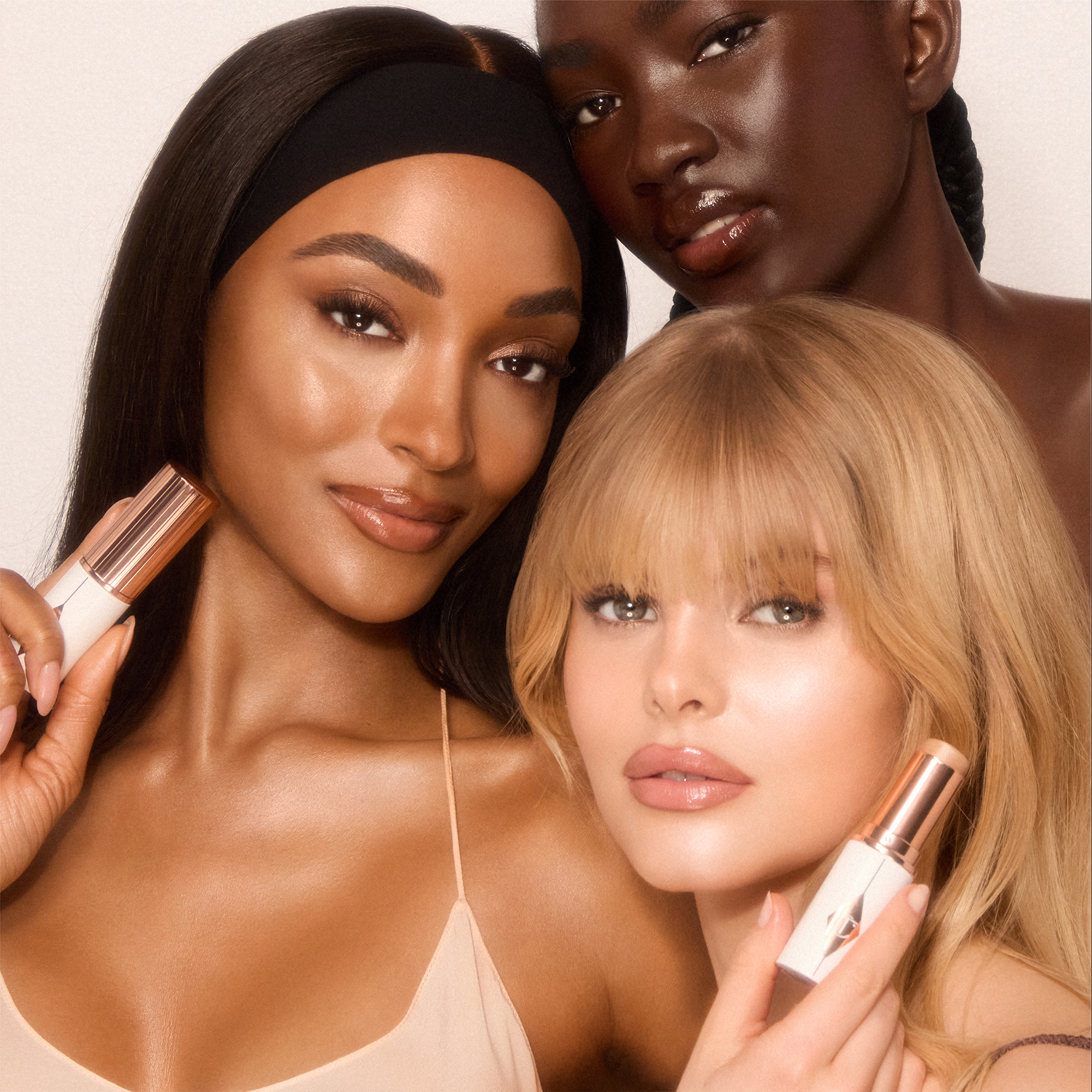 Models wearing Unreal Skin Foundation Stick