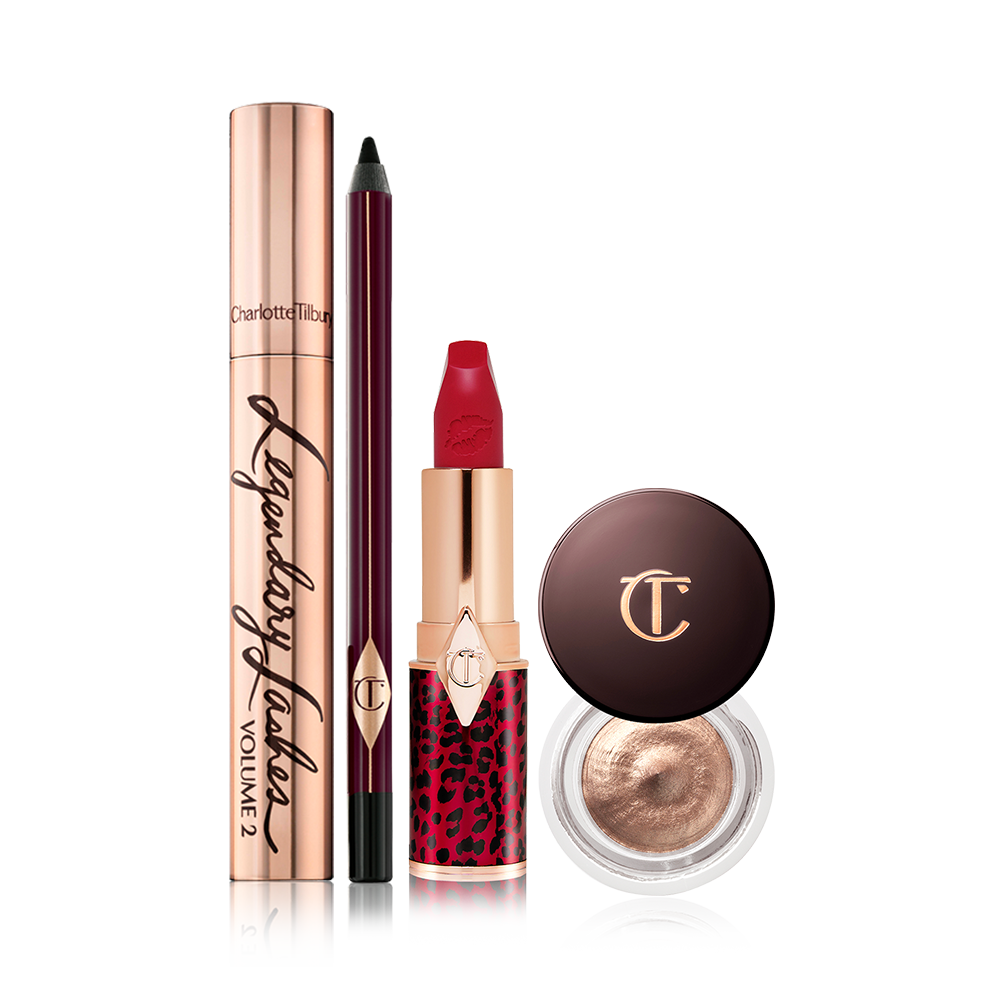 Black mascara in a gold-coloured tube, eyeliner pencil in a black colour, bold red lipstick, and cream eyeshadow in a petite pot with a dark brown-coloured serum.