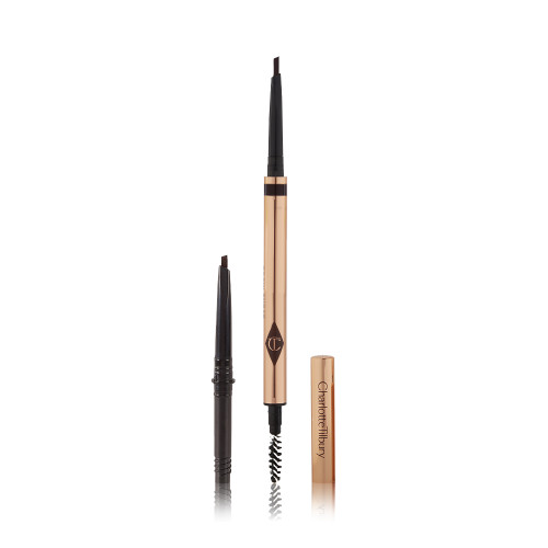 A double-ended eyebrow pencil and spoolie brush duo in a black brown shade with gold-coloured packaging and the refill besides it.